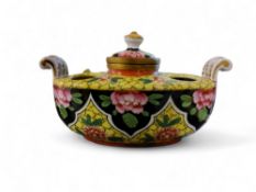 A Sevres style boat shaped inkwell, with pen and seal holders,  decorated with peonies on a yellow