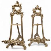 A pair of Rococo design brass table easels, cast and pierced with scrolls, 23cm high