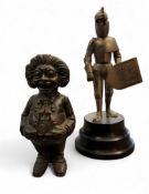 A cast-metal 'Golly' money bank, probably John Harper Ltd,  16cm high;   a novelty musical wind-up