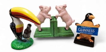 A pair of cast iron pig  bookends, 14cm high;   a replica cast iron My Goodness My Guinness