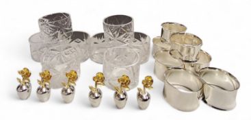 A set of six gilt metal and plated name holders, in the form of flowers, 3.75cm high;   a set of