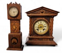 An oak mantel clock, in the form of a longcase clock, 27.5cm high;  a German mantel clock, eight day