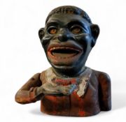 A Victorian cast iron Jolly black man money bank,  16cm high