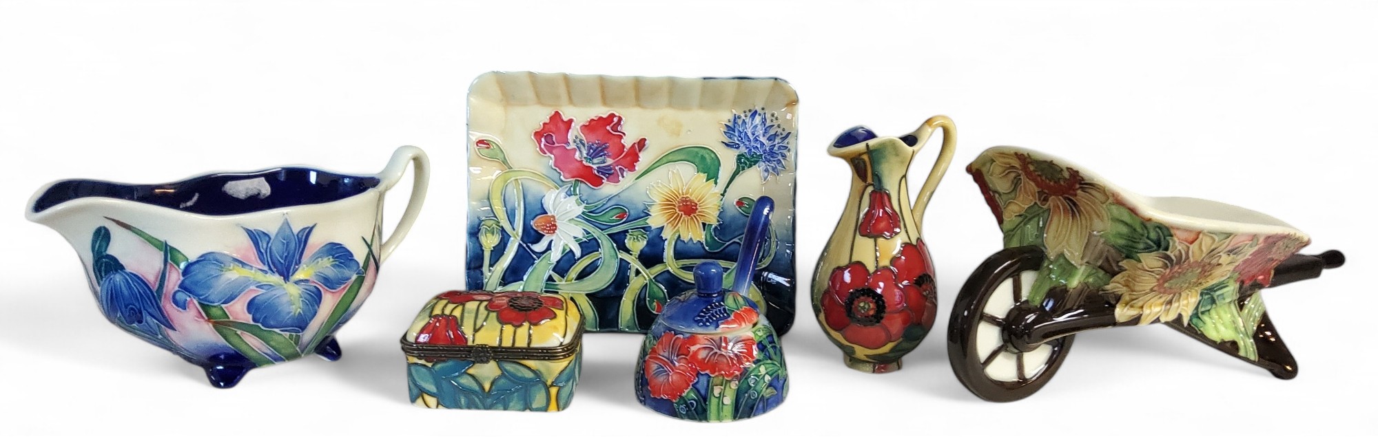 An Old Tupton Ware wheel barrow, tube lined with stylised flowers, printed mark, boxed;  a similar