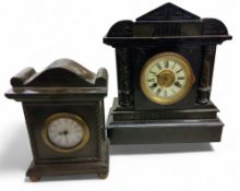 A 19th century German mantel clock. in faux slate, Roman numerals, twin winding holes, 14 day