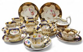 A set of four mid 19th century coffee cups and saucers, three similar coffee cups and saucers,