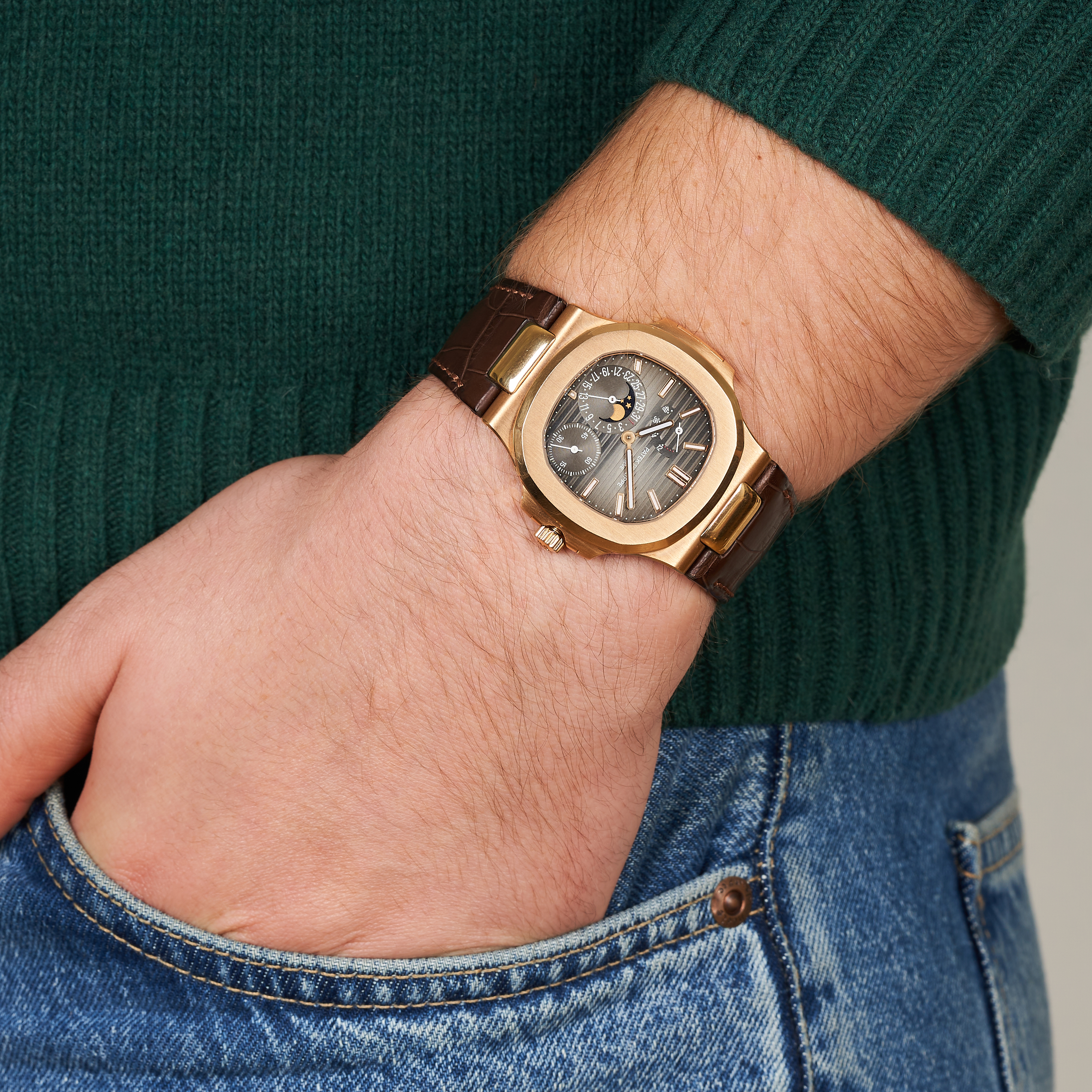 PATEK PHILIPPE - A NAUTILUS 18CT ROSE GOLD WRISTWATCH WITH POWER RESERVE, MOON PHASE, AND DATE, r... - Image 7 of 7