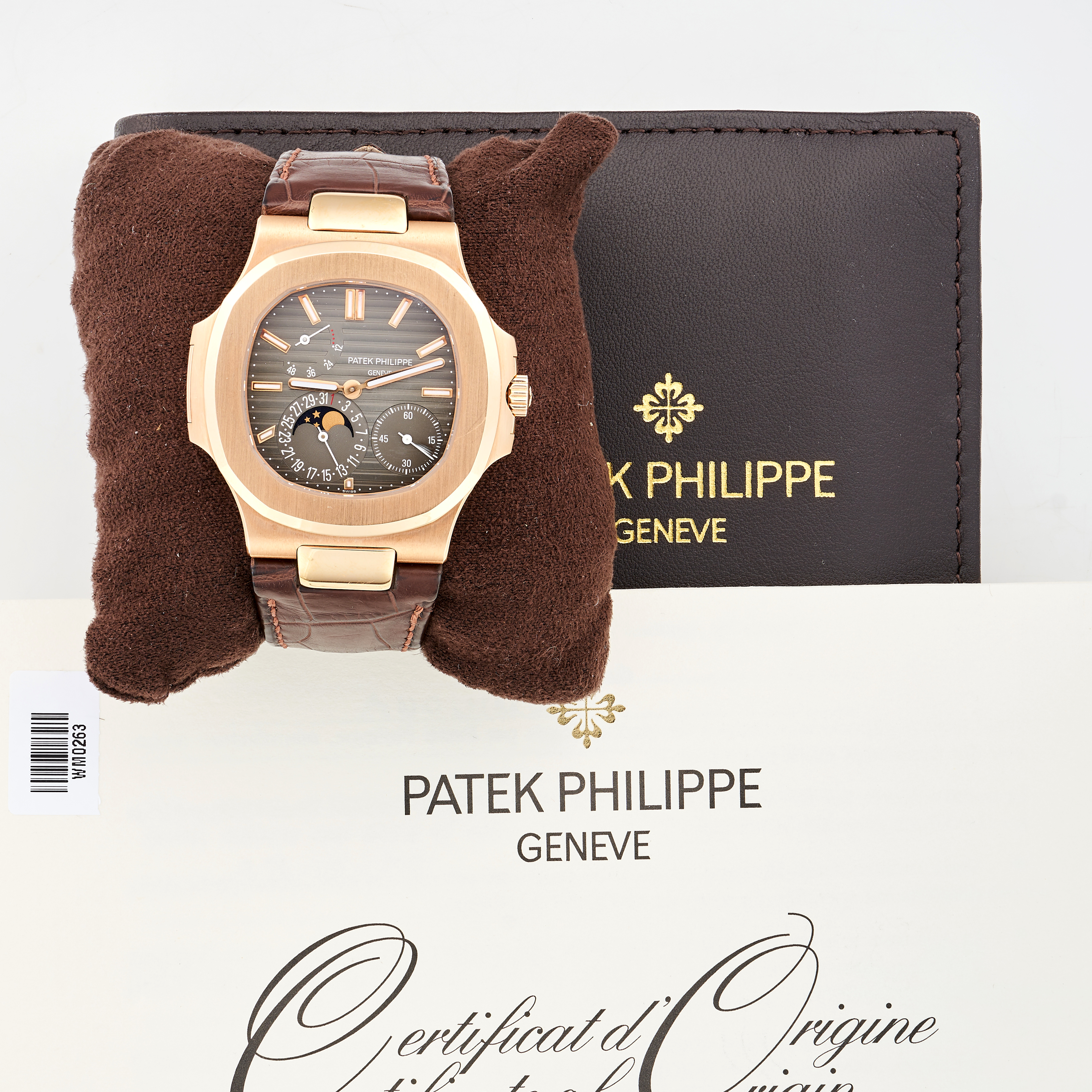 PATEK PHILIPPE - A NAUTILUS 18CT ROSE GOLD WRISTWATCH WITH POWER RESERVE, MOON PHASE, AND DATE, r... - Image 2 of 7