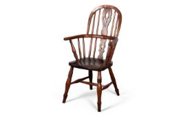 A 19TH CENTURY CHILD'S OAK AND ELM WINDSOR ARMCHAIR