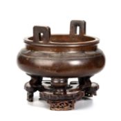 A LARGE CHINESE BRONZE TRIPOD CENSER