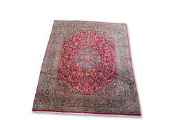 A PERSIAN MASHAD CARPET