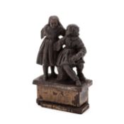 A CARVED WOOD FIGURE GROUP