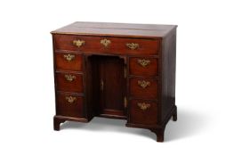 AN 18TH CENTURY MAHOGANY KNEEHOLE DESK