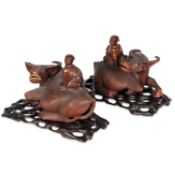 A PAIR OF CHINESE CARVED HARDWOOD MODELS OF WATER BUFFALO, EARLY 20TH CENTURY