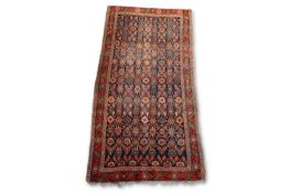AN ANTIQUE BIDJAR CARPET