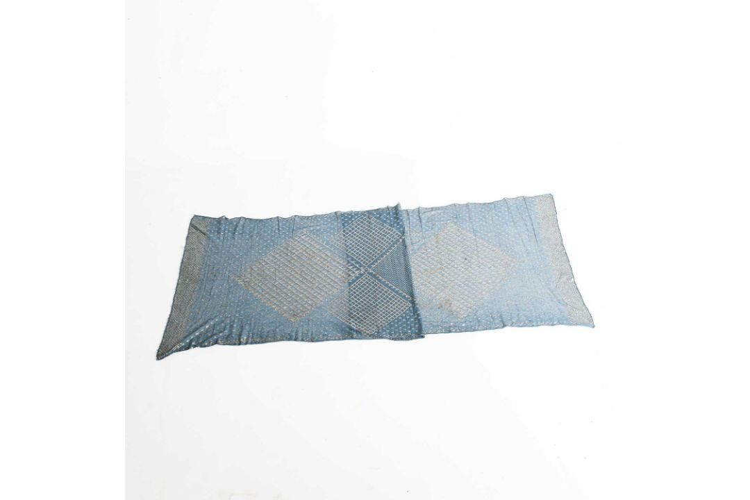 A 1920S EGYPTIAN HAMMERED SILVER AND BLUE LACE SHAWL - Image 1 of 7