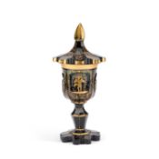 A 19TH CENTURY GILDED GREEN GLASS GOBLET AND COVER