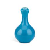 A BLUE-GLAZED POTTERY VASE, CIRCA 1900