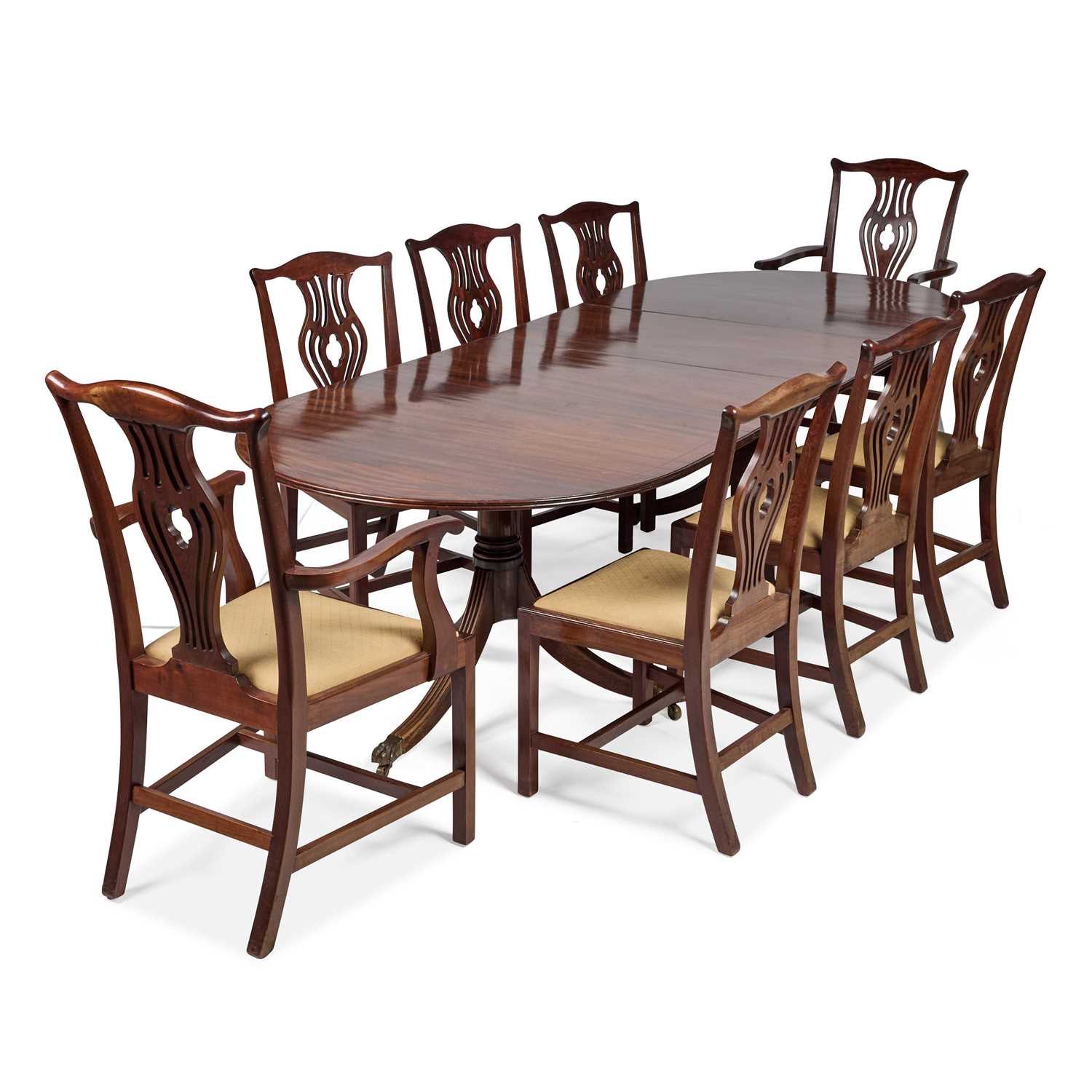 A REGENCY STYLE EBONY STRUNG MAHOGANY TWIN PEDESTAL DINING TABLE