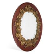 A CONTINENTAL METAL-MOUNTED MAHOGANY MIRROR