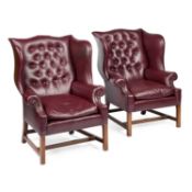A PAIR OF GEORGIAN STYLE DEEP-BUTTONED WING-BACK ARMCHAIRS