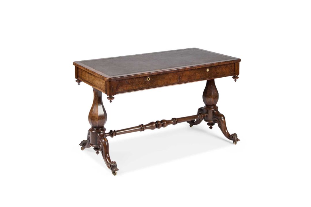 A VICTORIAN WALNUT WRITING TABLE
