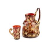 A MOSER GILT AND ENAMELLED AMBERLINE GLASS PITCHER AND BEAKER, EARLY 20TH CENTURY