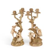 A PAIR OF ROYAL WORCESTER FIGURAL CANDELABRA