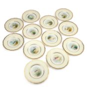 A SET OF TWELVE WEDGWOOD FISH PLATES BY ARTHUR DALE HOLLAND
