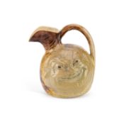 THE MARTIN BROTHERS A DOUBLE-SIDED STONEWARE POTTERY FACE JUG