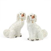 A PAIR OF VICTORIAN STAFFORDSHIRE POTTERY MODELS OF SEATED SPANIELS