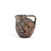 THE MARTIN BROTHERS A DOUBLE-SIDED STONEWARE POTTERY FACE JUG