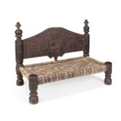 AN AFGHAN CARVED SQUATTING STOOL
