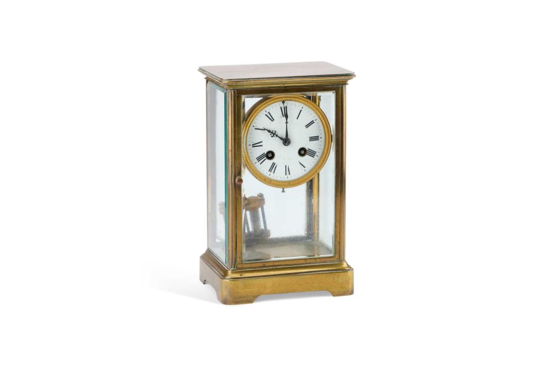 AN EARLY 20TH CENTURY BRASS FOUR-GLASS MANTEL CLOCK SIGNED MAPLE & CO LTD, PARIS