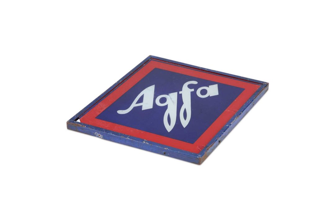 AN AGFA PAINTED GLASS ADVERTISING SIGN