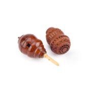 A 19TH CENTURY CARVED COQUILLA NUT SPICE SHAKER