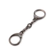 AN ELIZABETH II SILVER NOVELTY KEYRING