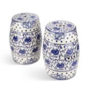 A PAIR OF BLUE AND WHITE POTTERY GARDEN SEATS IN THE CHINESE TASTE