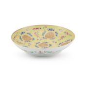 A CHINESE FAMILLE ROSE YELLOW-GROUND DISH