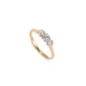 AN 18 CARAT GOLD THREE STONE DIAMOND RING