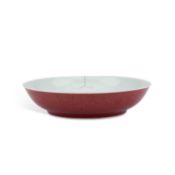 A CHINESE RED-BACKED SAUCER DISH