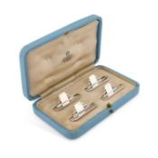 A SET OF FOUR ART DECO SILVER MENU HOLDERS