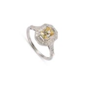 A CONTEMPORARY PLATINUM YELLOW SAPPHIRE AND DIAMOND RING