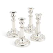 A SET OF FOUR GEORGE III SILVER TELESCOPIC CANDLESTICKS