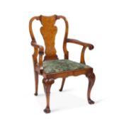A QUEEN ANNE STYLE WALNUT ELBOW CHAIR