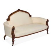A VICTORIAN WALNUT AND UPHOLSTERED SETTEE