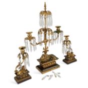 A 19TH CENTURY ORMOLU AND LUSTRE DROP THREE-PIECE CANDLESTICK GARNITURE