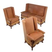 AN EARLY 20TH CENTURY WALNUT AND UPHOLSTERED HIGH-BACK SETTEE AND PAIR OF ARMCHAIRS