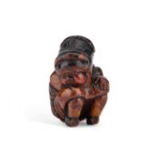 A 19TH CENTURY PRIMITIVE FIGURAL SNUFF BOX