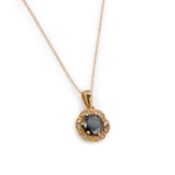 AN 18K GOLD BLACK DIAMOND AND DIAMOND PENDANT ON CHAIN